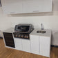 Grill King Signature Series Outdoor BBQ Kitchen Package – Rockpool White Stone Bench-Top, White Aluminium Cabinets | 4-Burner Built-In BBQ + Rotisserie + 150L Outdoor Fridge
