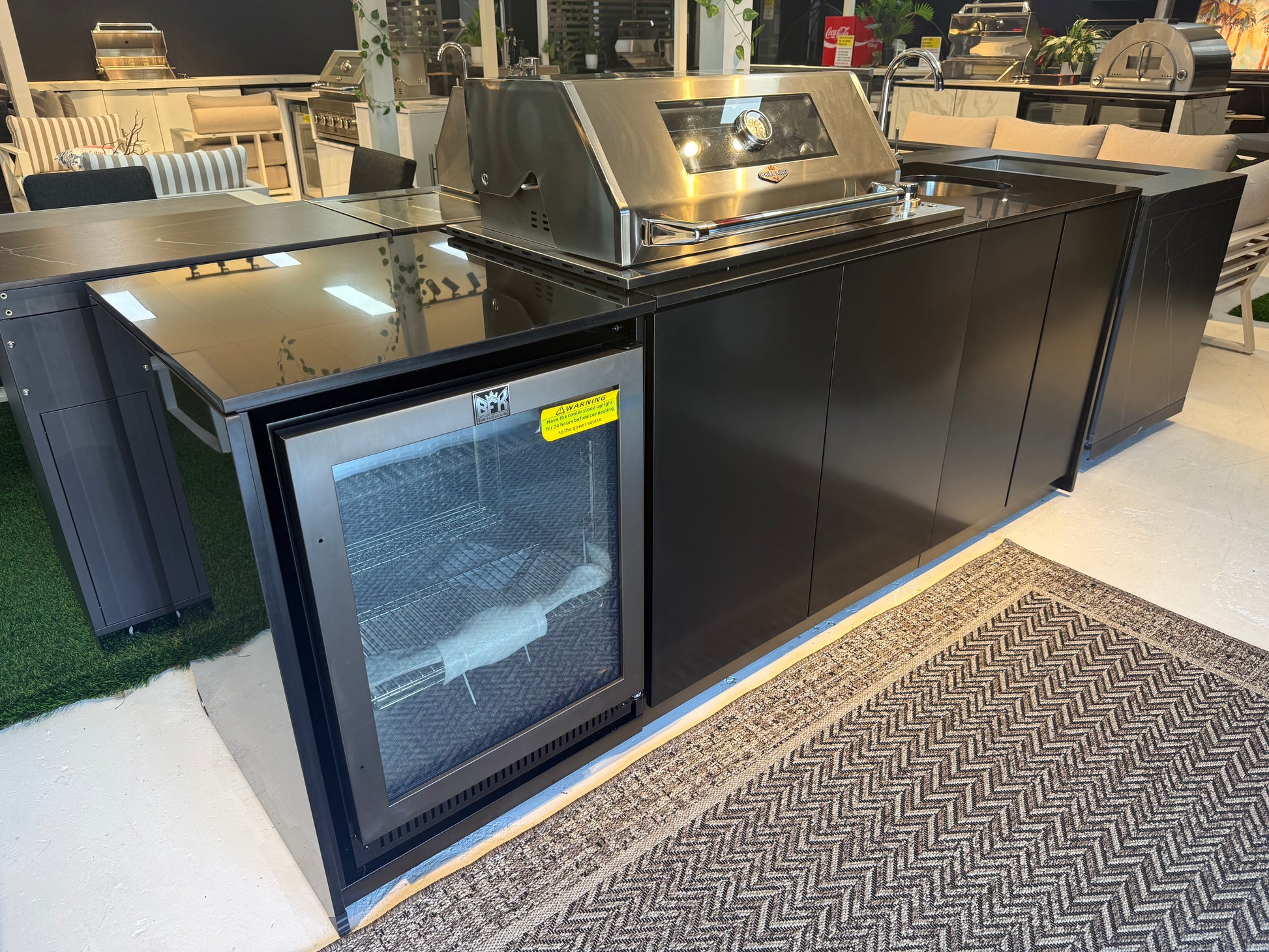 Grill King Signature Series Outdoor BBQ Kitchen Package – Rockpool Black Stone Bench-Top, Black Aluminium Cabinets | 4-Burner Built-In BBQ + Rotisserie + 150L Outdoor Fridge